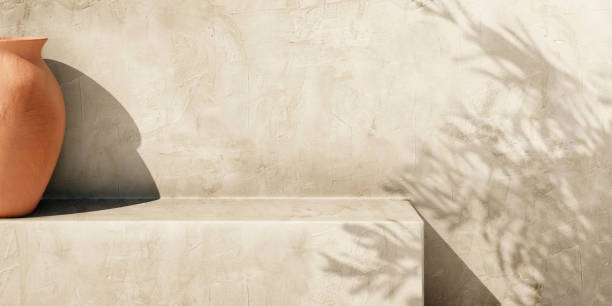 Olive tree shadow on beige rustic wall with clay pot. Olive tree shadow on beige rustic wall with clay pot. Summer mediterranean traditional home architecture design, neutral aesthetic. Texture paint plaster facade mockup background. light concrete texture stock pictures, royalty-free photos & images