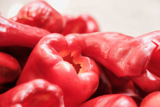Preparing red paprika pepper for roasting for winter