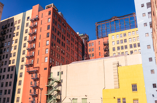 A group of brightly painted buildings in the historic Fashion Distric of central Los Angeles.