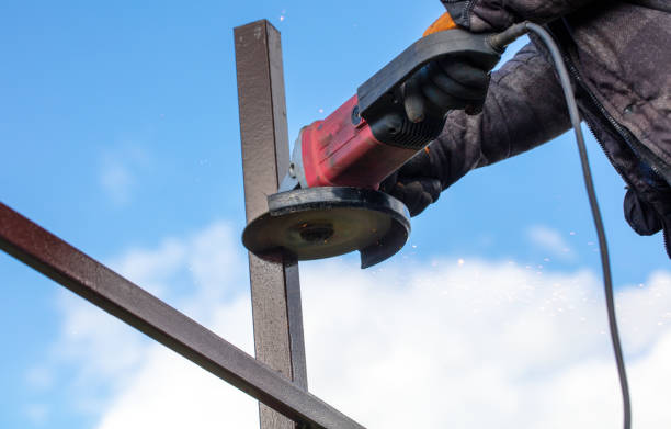 istock A worker is cutting metal to install a fence 2058424052
