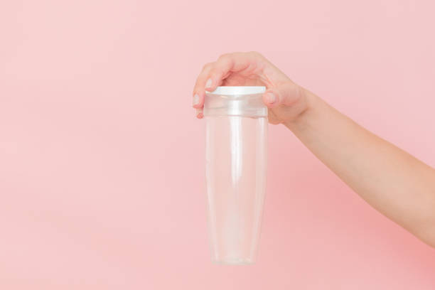 istock Female hand holds blank cosmetic container. Cosmetic beauty packaging 2058428493