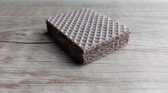 Chocolate wafers on a wooden background. Selective focus.