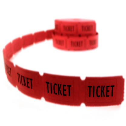 Rolls of red tickets connected together for admission or entrance to show or entertainment on white background