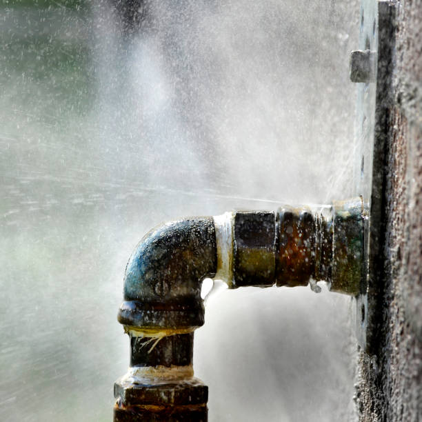 istock Old Leaky Pipes Squirting Water Leak Spray 2058434580