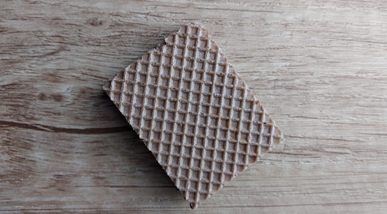 Chocolate wafers on a wooden background. Selective focus.