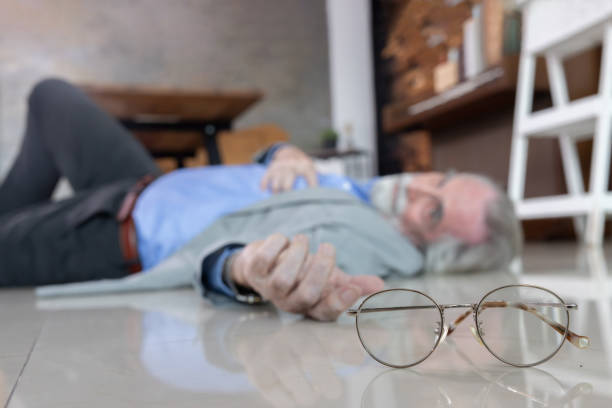 istock Senior man lying unconcious suffer from heart attack in his room 2058436499