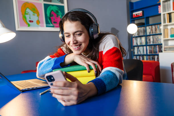 istock A cheerful woman consuming online content 2058458550