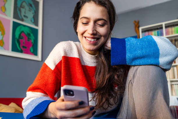 istock Woman using a smart phone. Text messaging. Online messaging. 2058458560