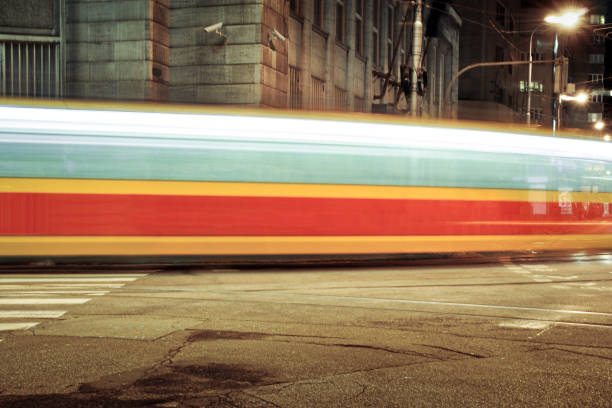 Bratislava, Slovakia - January 31 2013: long exposure image of tram  passing street corner in downtown. Rapid city transit.