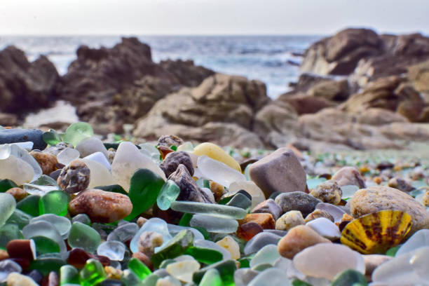 istock Colored crystals in the sand on a beach. Tourist place 2058464923