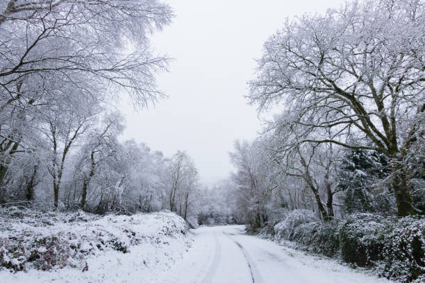istock Dangerous journey on a snowy mountain road 2058465995