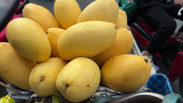 Mangoes Tropical Fruits Displayed Asian Southeast Market Store Dolly shot closeup to Lansium domesticum Longkong, Duku