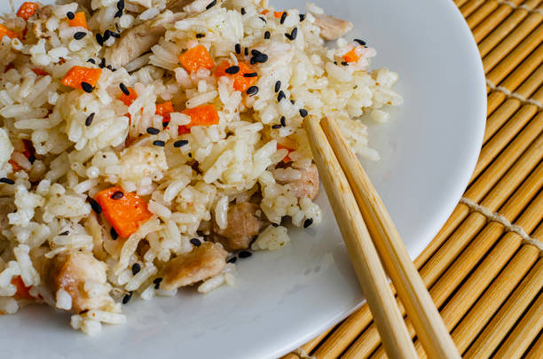 Colombian-Style arroz con pollo on white background. Rice with chicken is one of the most popular dishes in Colombia and South America.