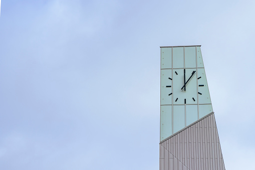 Ede, The Netherlands - March 1, 2024: Clock tower of new Central Station Ede-Wageningen, which was developed based on sustainability principles.