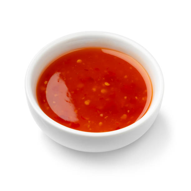 istock Single white bowl with sweet chili sauce on white background close up 2058505295
