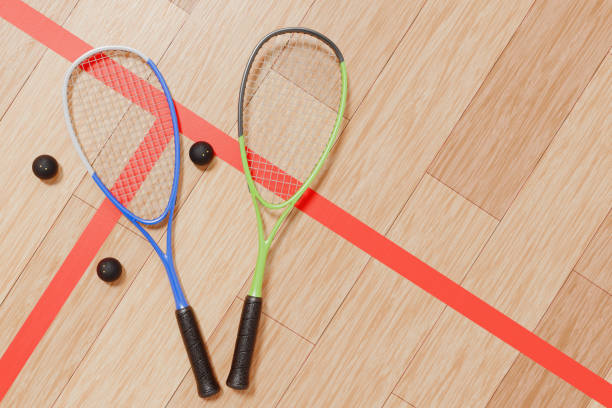 istock Two squash rackets and balls on the court floor. 3d rendering 2058514030