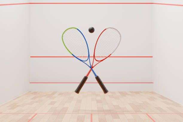 Squash player hitting the ball