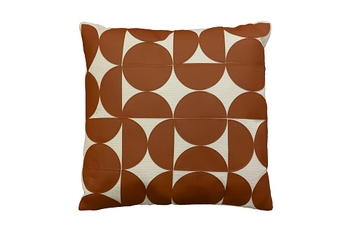 Decorative pillow with brown geometric pattern isolated on white background