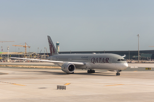 Doha, Qatar - February 20, 2024 : Boeing 787-9 Dreamliner aircraft, operated by Qatar Airways at the Hamad International Airport in Doha, Qatar.