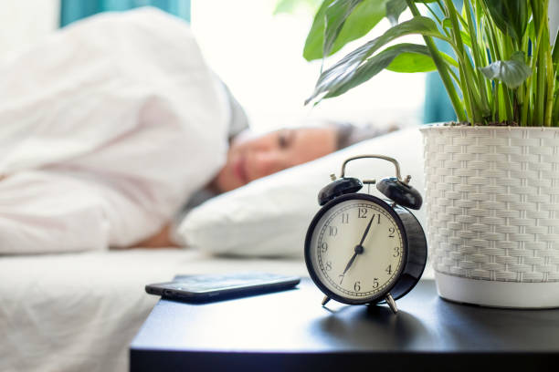 Morning Alarm Clock and Sleeping Person