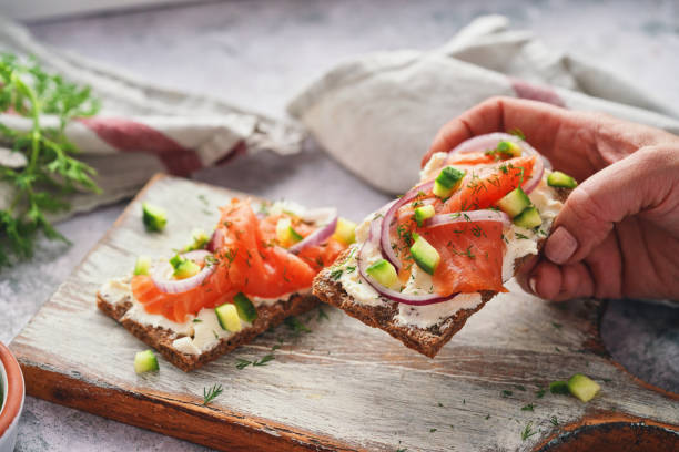 istock Salmon with Cottage Cheese and Cucumber on Toasted Bread 2058552622