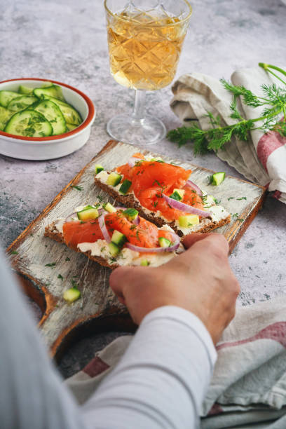istock Salmon with Cottage Cheese and Cucumber on Toasted Bread 2058552623