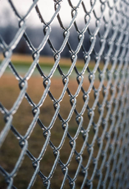 istock Ice Coated Fence Close-up Vertical 1987 2058553670