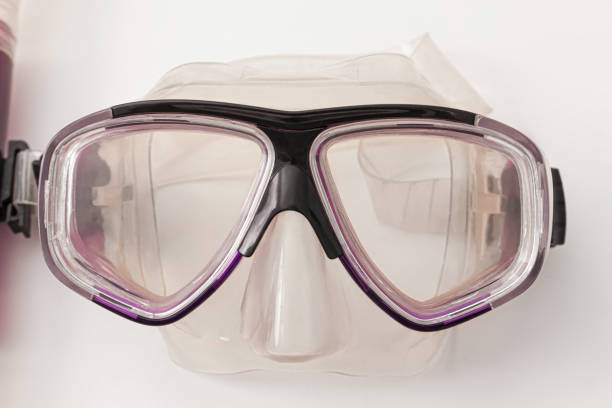 Purple plastic diving and snorkeling mask isolated on white background