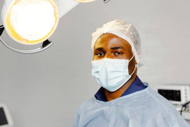 istock Man wearing surgical mask in hospital 2058607065