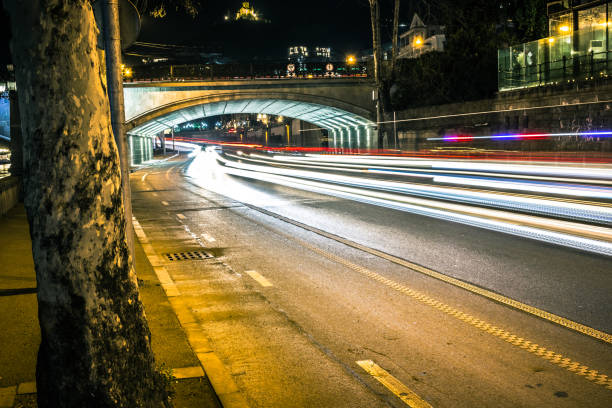 Long exposure car light trails on the road under the bridge,  Tbilisi , Georgia