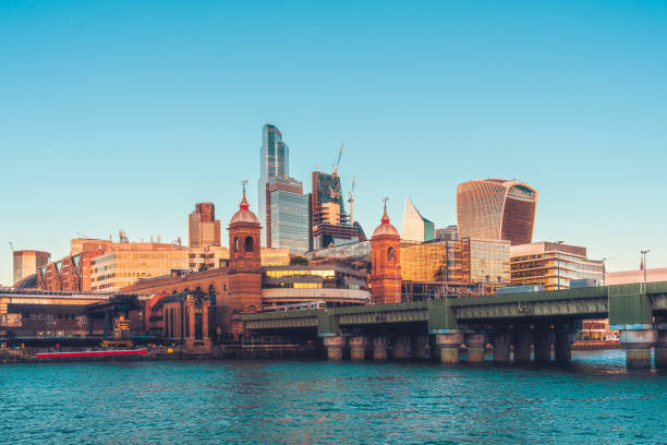 london financial district skyscrapers overlooking river thames - english culture uk promenade british culture fotografías e imágenes de stock