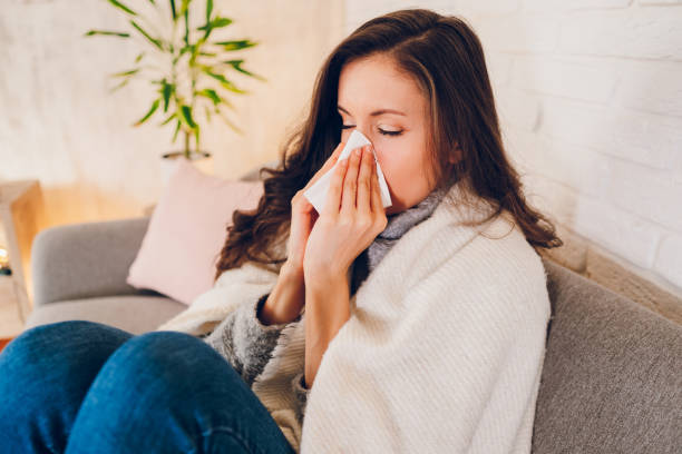 istock Sick woman sitting at home 2058677277