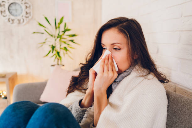 istock Sick woman sitting at home 2058678884