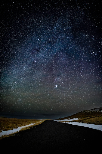 Night sky over road to Krysuvikurkirkja full of stars