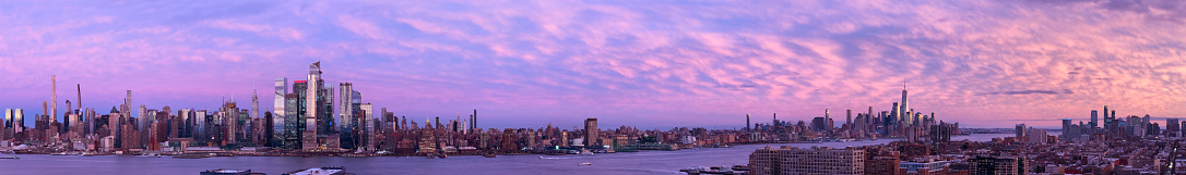 Panoramic view of Manhattan with beautiful sunset sky
