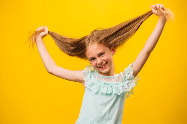 istock Funny girl grimaces in front of the camera. 2058720794