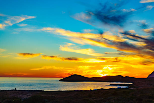 Sunset over sea. Seaside evening landscape. Calblanque Beach, Murcia Spain.