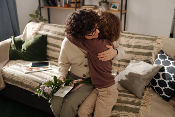 istock Young mother embracing adorable son 2058743778