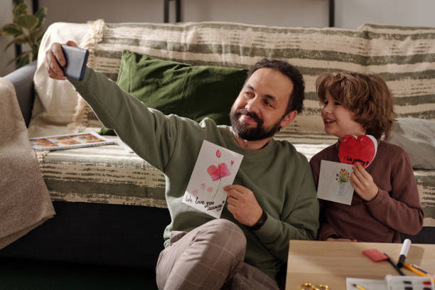 istock Livestream of creative father and son 2058743830