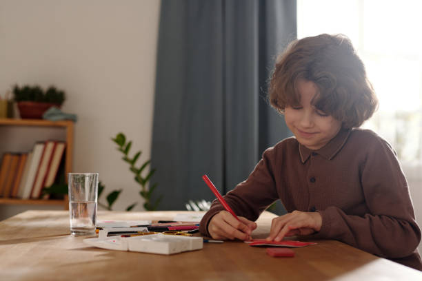 istock Child drawing on handmade paper postcard 2058743843