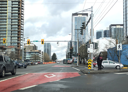 Surrey, Canada - March, 2, 2024: Traffic heads north on King George Boulevard at 96th Avenue. New construction of condo towers line this popular transit route to downtown in the Whalley neighbourhood.