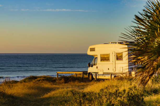 istock Camper rv camping on sea shore, Spain 2058761287
