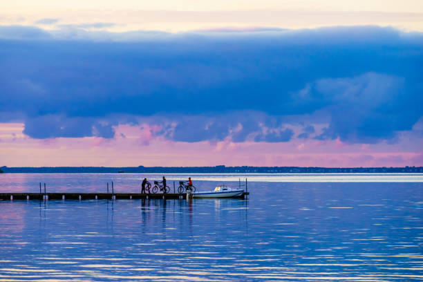 istock Seascape with boat on pier 2058764937