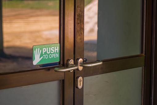 Close-up of the door with sign on it