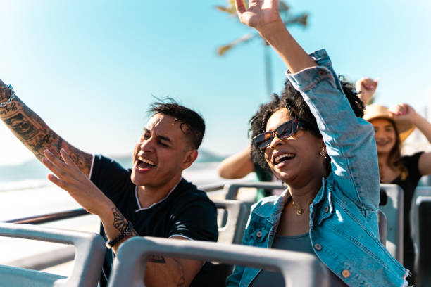 istock Tourists couple having fun on tourist bus 2058786764
