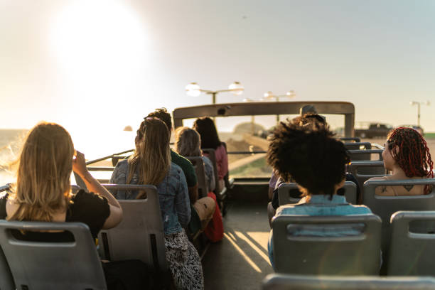 istock Tourists looking at view on tourist bus 2058791573