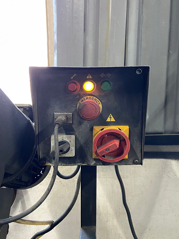 Industrial machine control panel in factory workshop