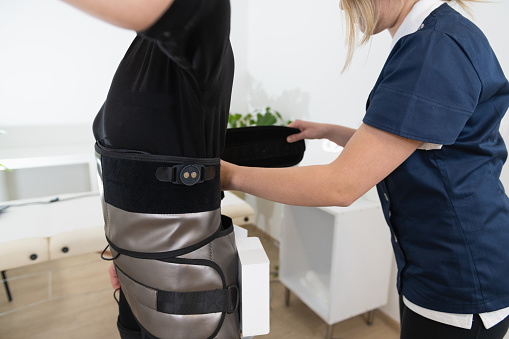 Young patient doing physiotherapy at a clinic