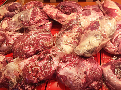 Red meats. Packages of refrigerated red meats. Variation of vacuum packed organic raw beefs