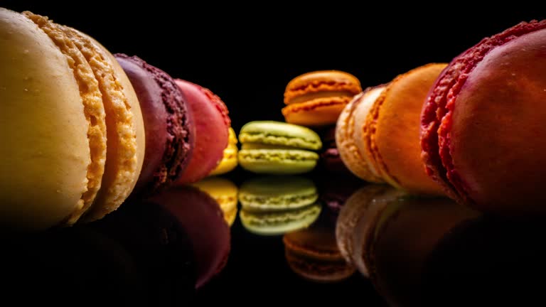 Row of Macarons on black background